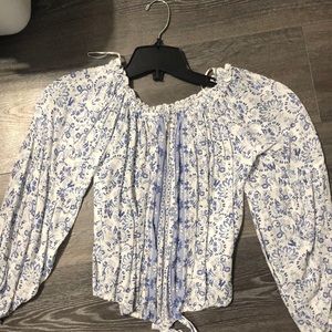 Off the shoulder white shirt with blue designs